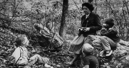 Rachel Carson out birding with children (Image via College of Staten Island, and Minnesota Historical Society)